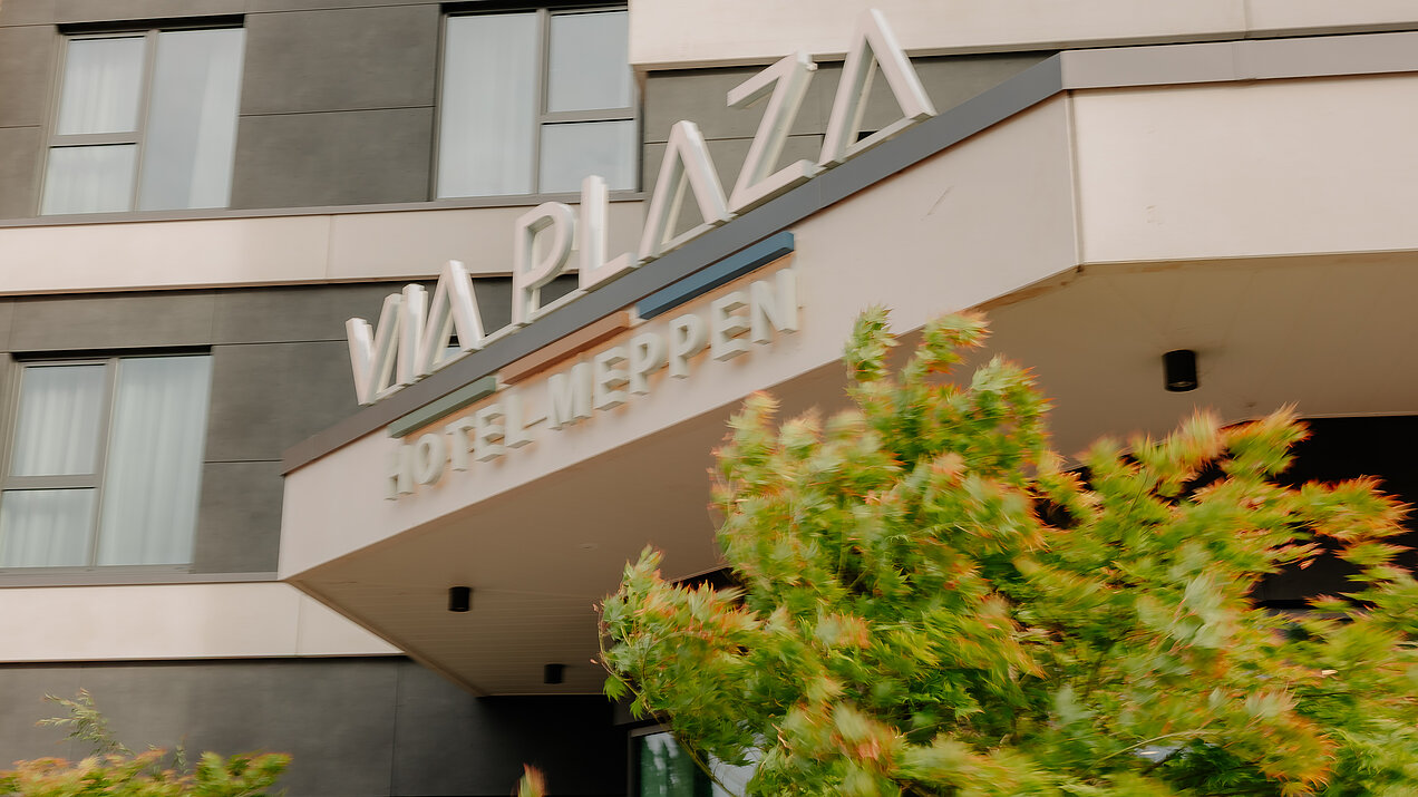 Hotel entrance with VIA PLAZA Meppen logo